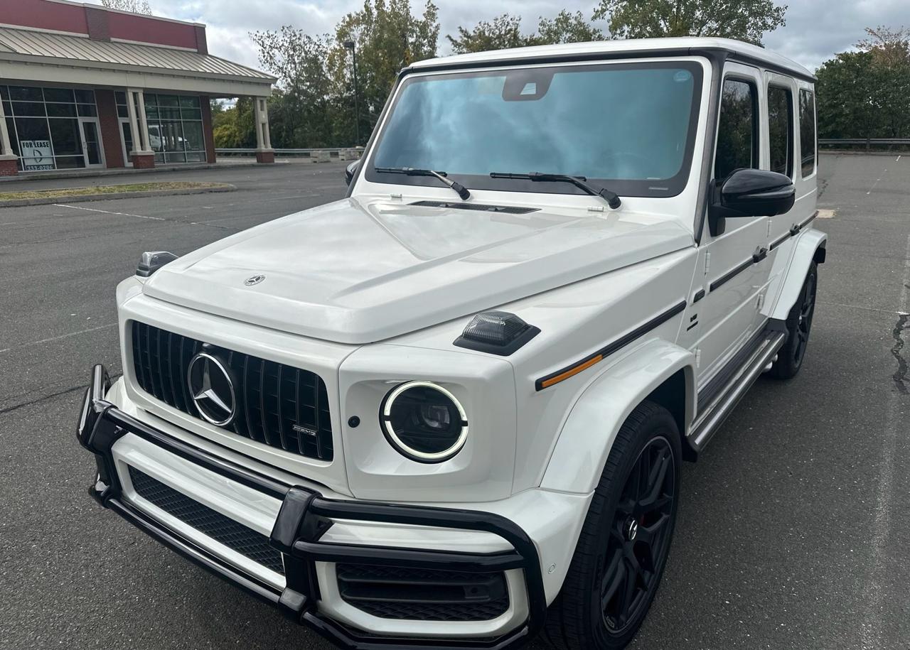 White Mercedes-AMG G63 before enclosed transport from Fort Lauderdale