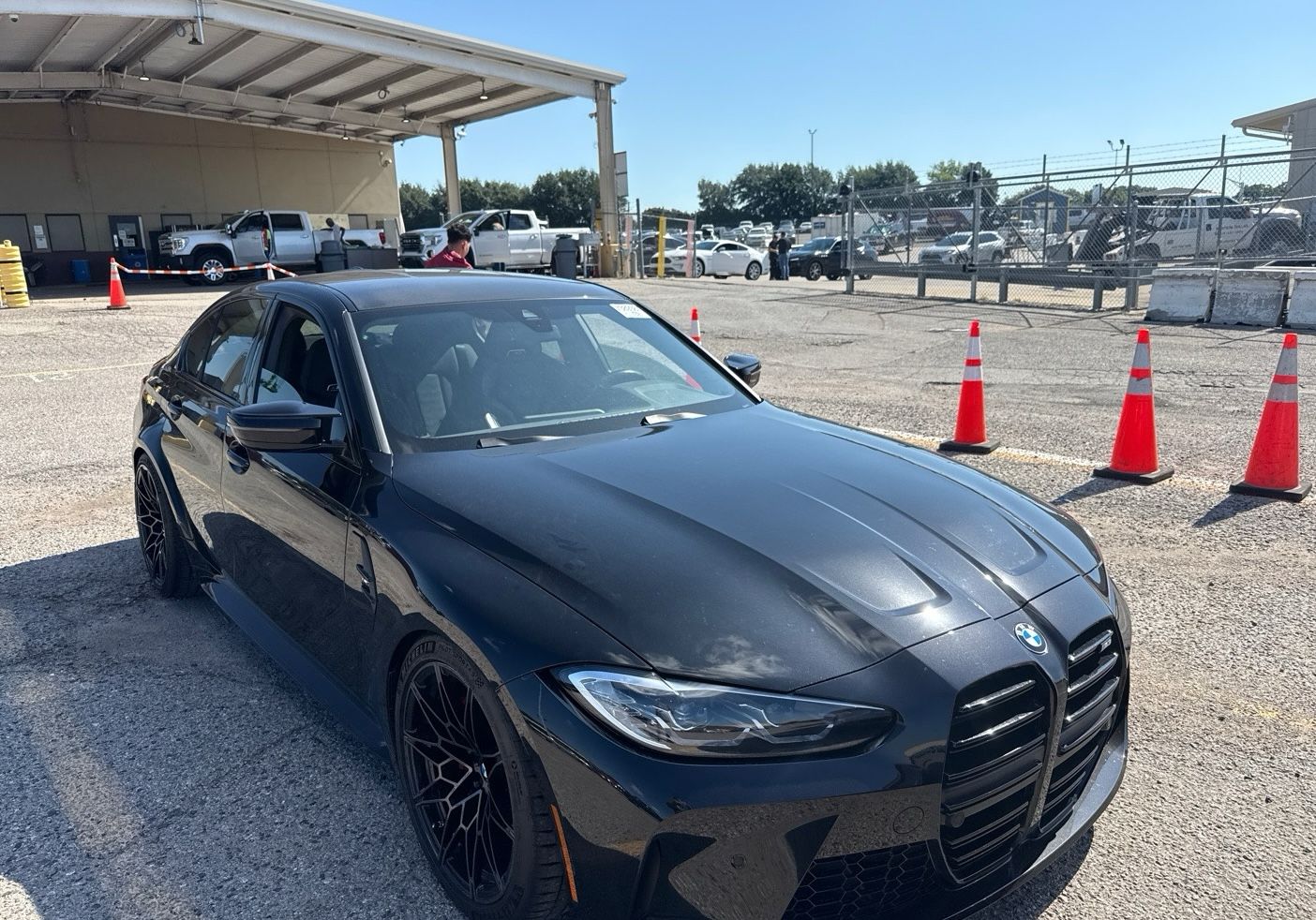 Black BMW M3 picked up in Michigan for a cross-country car hauler