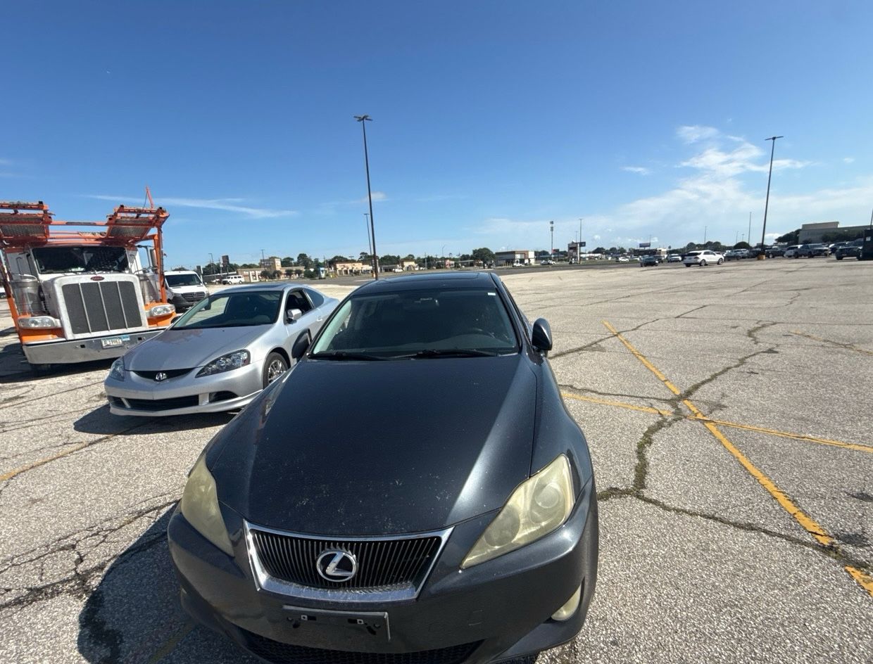 Lexus IS next to the car hauler in Arizona
